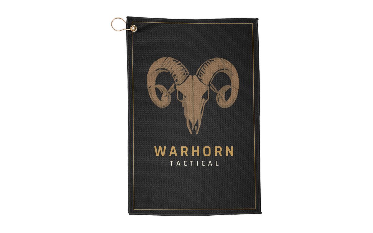 Ram Skull Range Towel: black towel with a large gold ram skull over WARHORN TACTICAL inside a thin gold frame