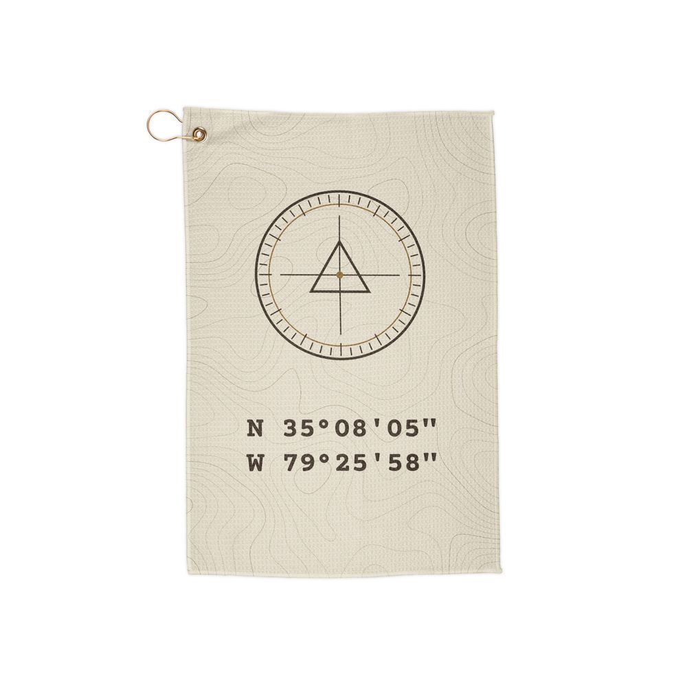 Bone Benchmark Range Towel: bone towel with topo lines, a survey benchmark marker and the coordinates N 35°08′05″ W 79°25′58″