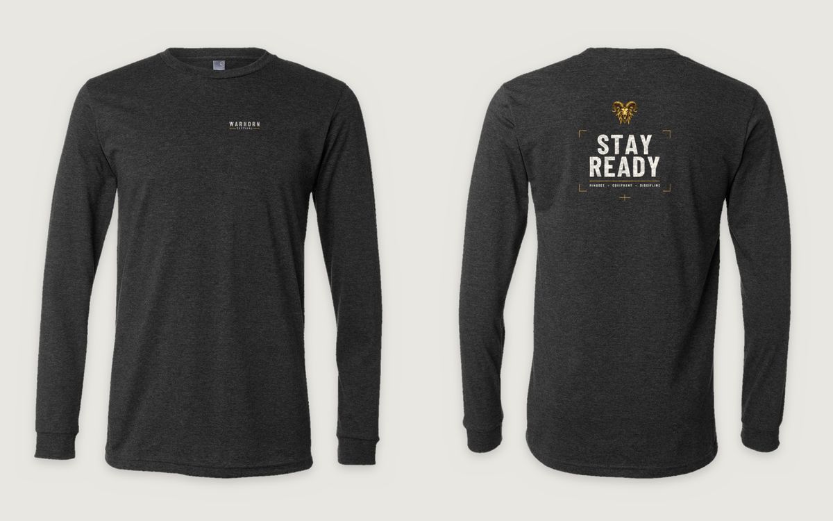 Stay Ready Long Sleeve in Dark Grey Heather shown front and back: WARHORN TACTICAL lockup with gold rules, left chest; back: Full-color Warhorn ram over “Stay Ready” and Mindset • Equipment • Discipline inside gold corner brackets