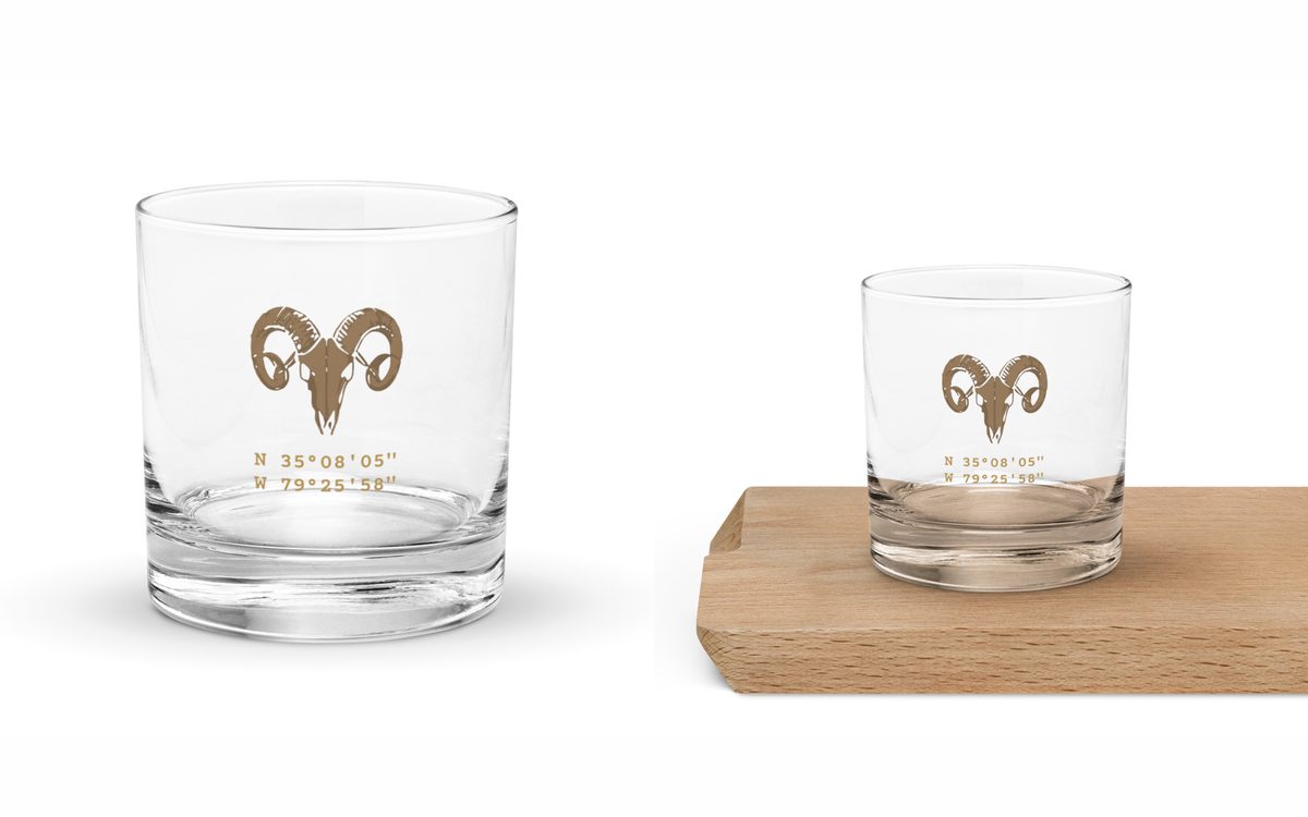 Warhorn Rocks Glass: clear glass with a gold ram skull and the coordinates N 35 08 05 W 79 25 58