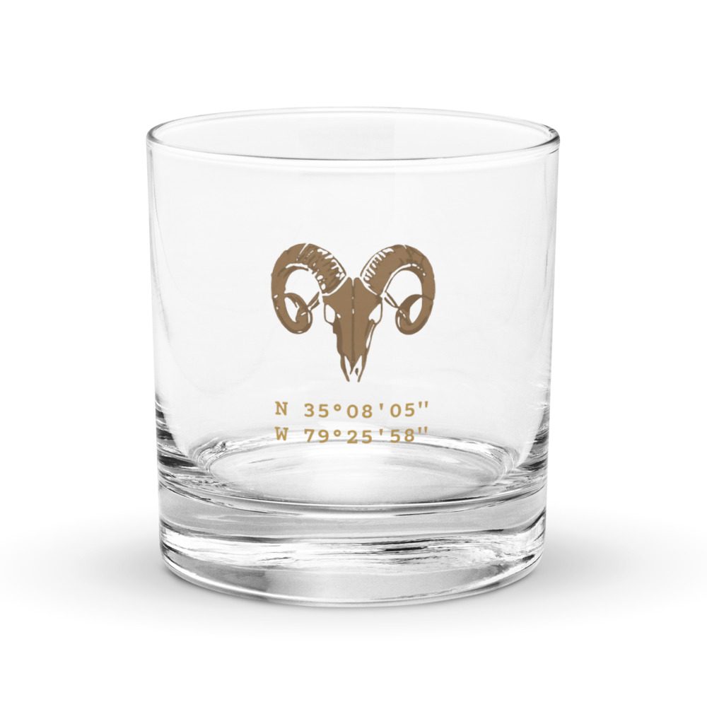 Warhorn Rocks Glass, front: gold ram skull over the coordinates N 35°08′05″ W 79°25′58″