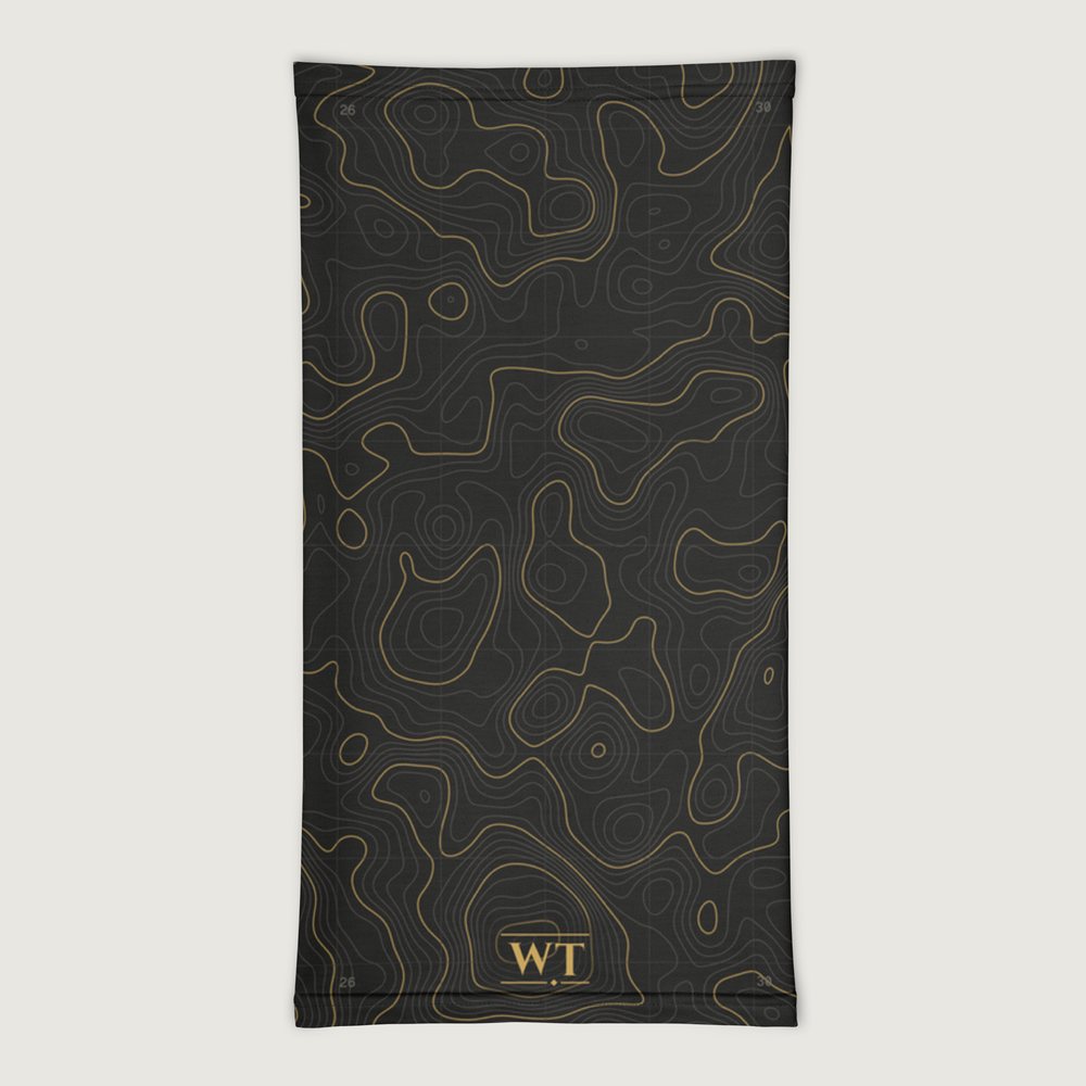 WT Neck Gaiter, Topo Grid design, laid flat: gold topographic contour lines on a black grid, small gold WT mark at the bottom front